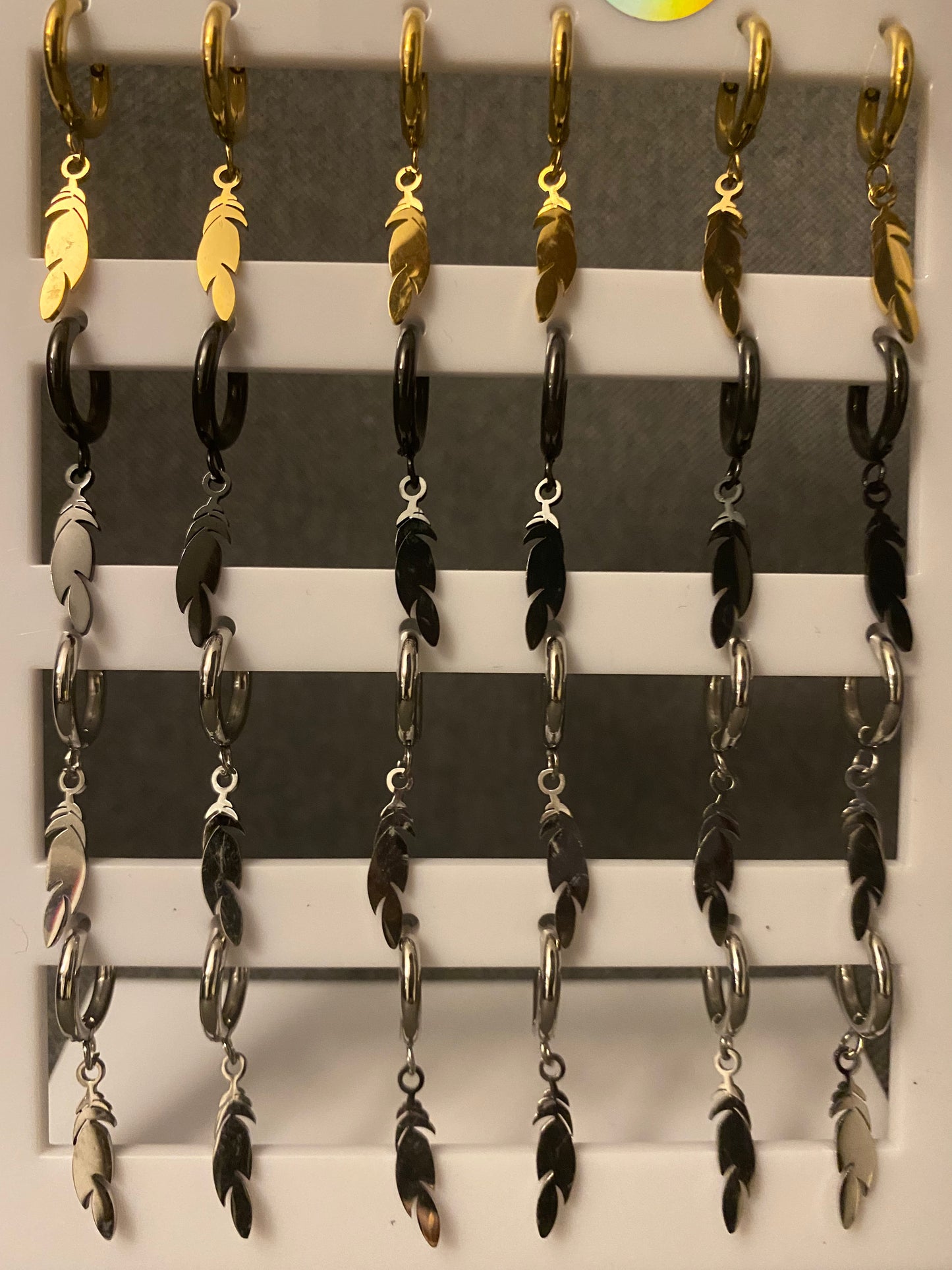 Mono-orecchini Piuma