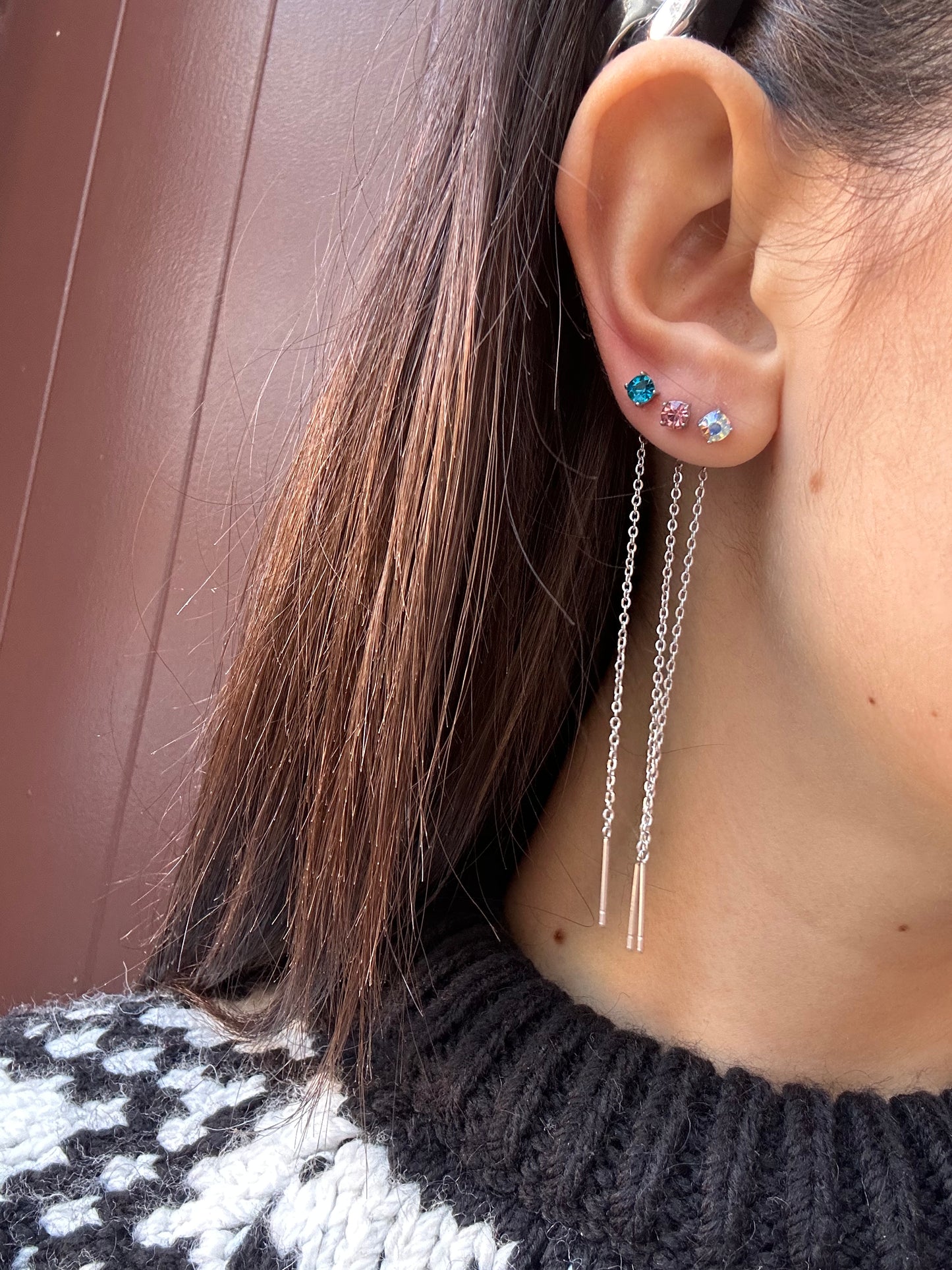 Mono-orecchini Niddle zircone