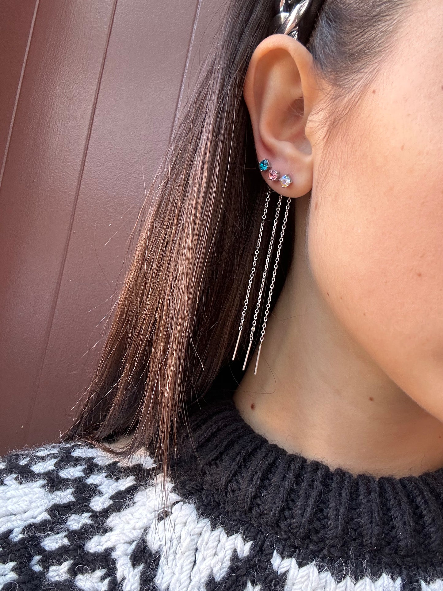 Mono-orecchini Niddle zircone