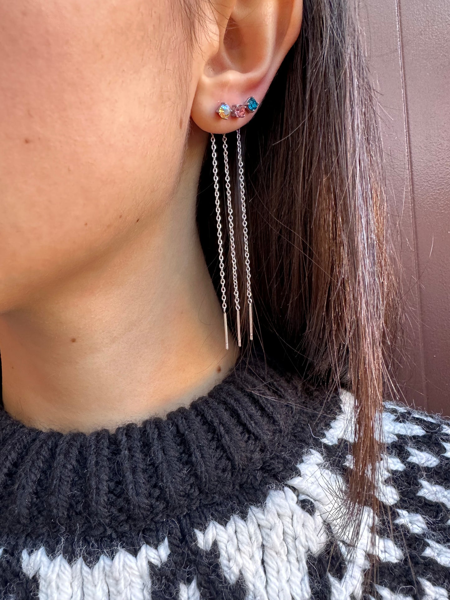 Mono-orecchini Niddle zircone