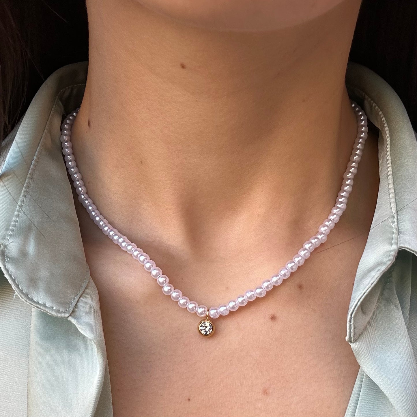 Collana di perle con punto luce