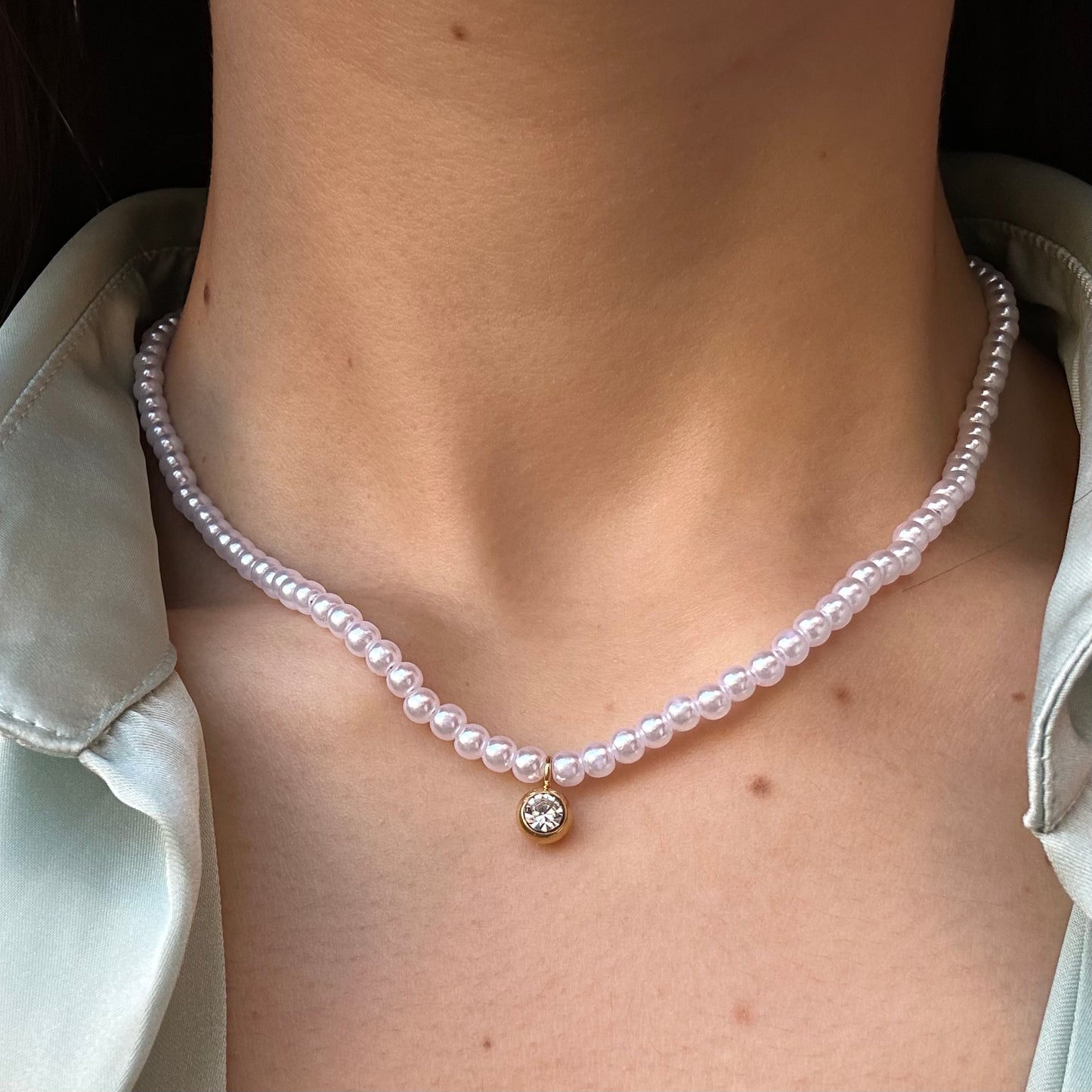 Collana di perle con punto luce