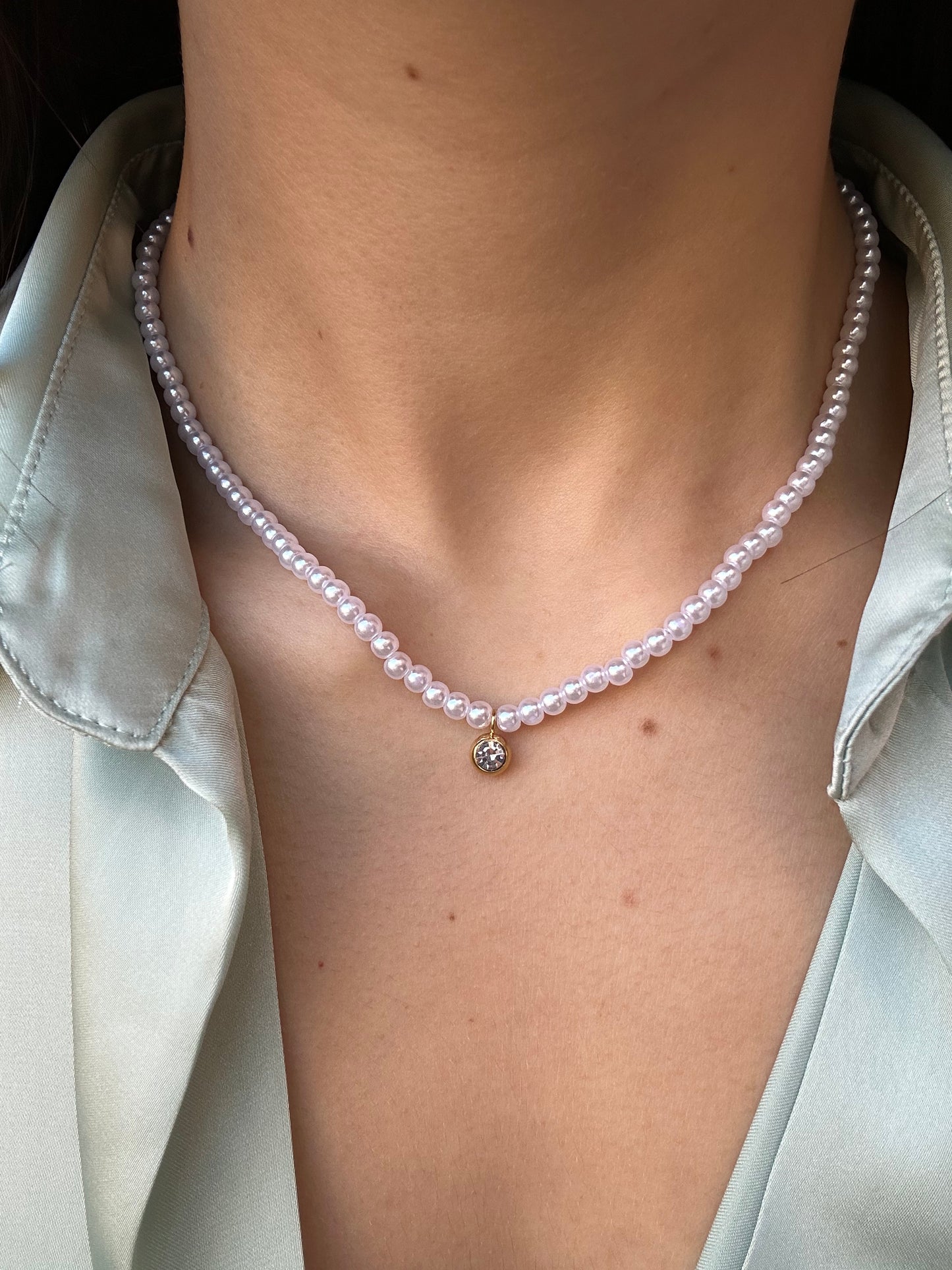 Collana di perle con punto luce